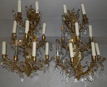 pair of brass and crystal 9 light sconces