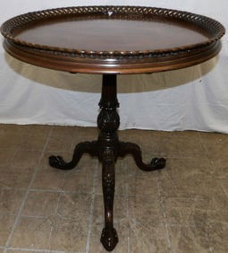 carved mahogany open work gallery tilt top tea table