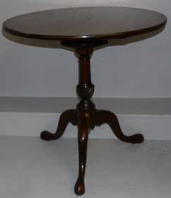 mahogany tilt top table with bird cage by Kittinger