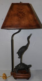 bronze and leather decorative lamp with heron on turtle motif
