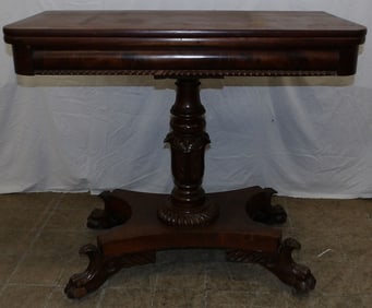 19th century carved mahogany classical fold over top game table