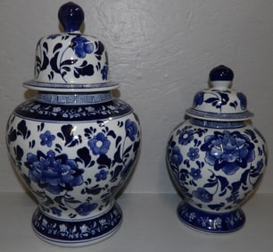 two Oriental blue and white covered urns