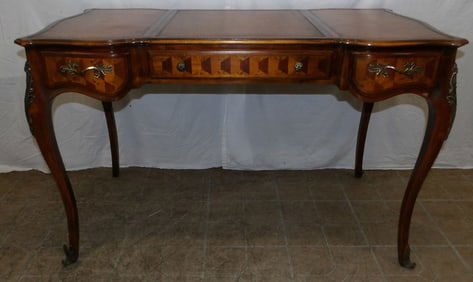 mahogany French style inlaid and tooled leather sliding top desk by Theodore Alexander