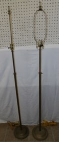 pair of brass floor lamps