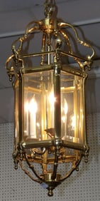 brass and glass lantern form four light chandelier