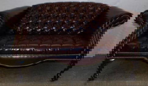 faux leather upholstered love seat by Gellespie Furniture
