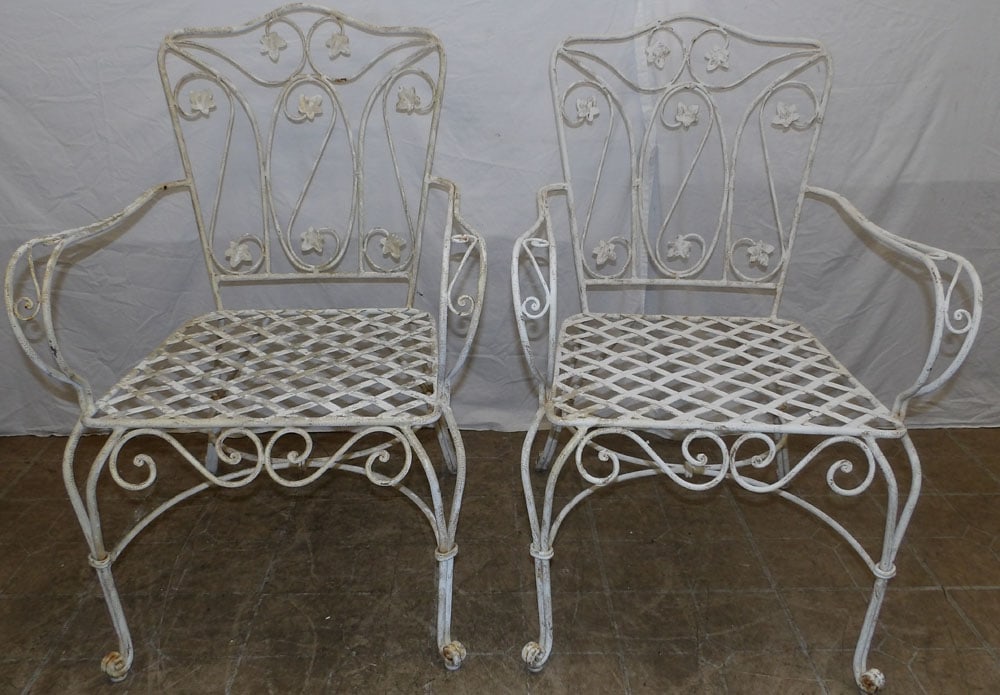 set of four painted wrought iron arm chairs: set of four painted wrought iron arm chairs . 37" H "ALL DESCRIPTIONS AND ANY CONDITION STATEMENT GIVEN BY LANGSTON AUCTION GALLERY ARE STRICTLY OPINIONS AND LANGSTON'S SHALL HAVE NO RESPONSIBILITY FO