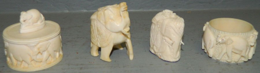 Four pieces of ivory.: Four pieces of ivory. Includes covered box, napkin ring and two netsuke elephants.