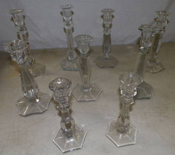 Lot of Glass Candlesticks : Lot of Glass Candlesticks . Up to 10" H 4 1/2" W 4 1/2" D ALL DESCRIPTIONS AND ANY CONDITION STATEMENT GIVEN BY LANGSTON AUCTION GALLERY ARE STRICTLY OPINIONS AND LANGSTON'S SHALL HAVE NO