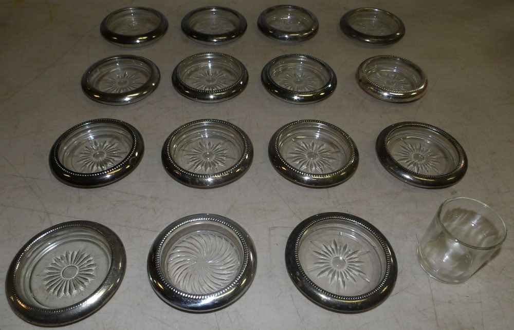 Lot of Glass & Silver Plated Rim Coasters: Lot of Glass & Silver Plated Rim Coasters. Up to 4" Dia. ALL DESCRIPTIONS AND ANY CONDITION STATEMENT GIVEN BY LANGSTON AUCTION GALLERY ARE STRICTLY OPINIONS AND LANGSTON'S SHALL HAVE NO RESPONSIBILIT
