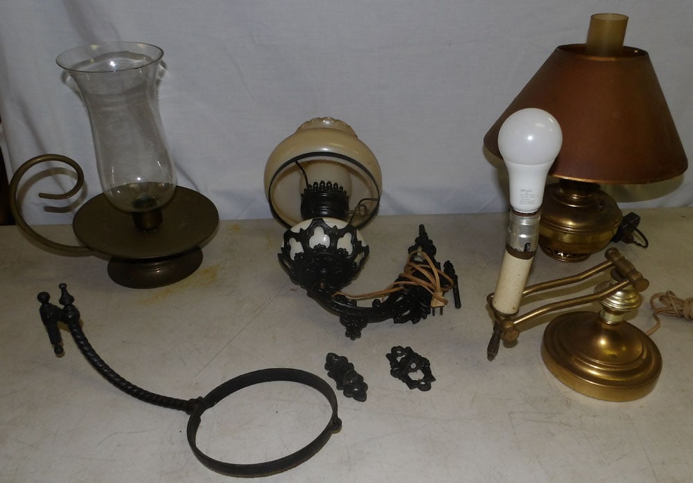 Lot of Brass & Cast Iron Lamps: Lot of Brass & Cast Iron Lamps. Up to 19" H 7" W 11 1/2" D ALL DESCRIPTIONS AND ANY CONDITION STATEMENT GIVEN BY LANGSTON AUCTION GALLERY ARE STRICTLY OPINIONS AND LANGSTON'S SHALL HAVE NO RESPONSIBIL