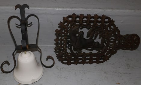 Virginia Metalcrafters cast iron trivet and porcelain and wrought iron dinner bell
