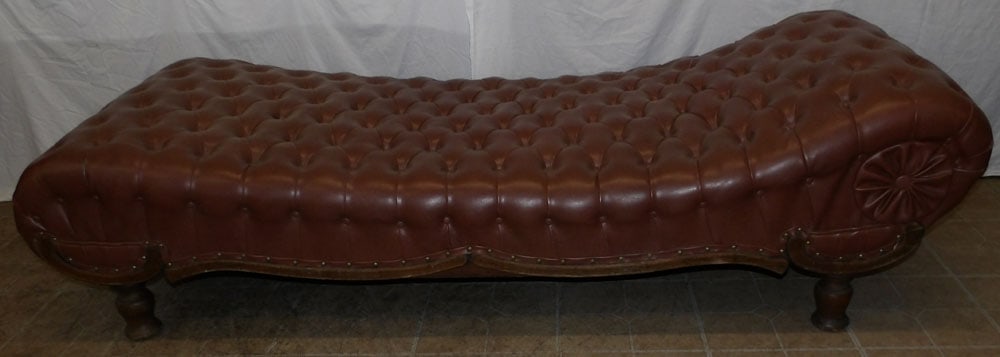 antique oak and vinyl upholstered chase lounge : antique oak and vinyl upholstered chase lounge . 20" H 72" W 30" D ALL DESCRIPTIONS AND ANY CONDITION STATEMENT GIVEN BY LANGSTON AUCTION GALLERY ARE STRICTLY OPINIONS AND LANGSTON'S SHALL HAVE NO RES