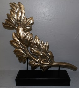 painted resin sculpture on wood stand