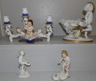 porcelain cupid compote candelabra and 2 figurines