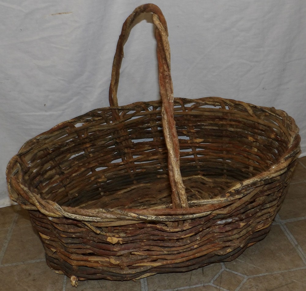 rustic twig woven basket : rustic twig woven basket . 18 1/4" H 24" W 20" D ALL DESCRIPTIONS AND ANY CONDITION STATEMENT GIVEN BY LANGSTON AUCTION GALLERY ARE STRICTLY OPINIONS AND LANGSTON'S SHALL HAVE NO RESPONSIBILITY FOR ER