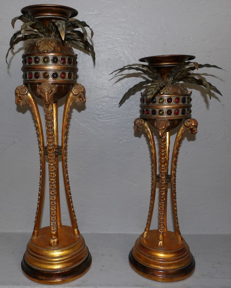 2 gilded metal and resin candle holders with rams heads : 2 gilded metal and resin candle holders with rams heads . Up to 21 1/2" H 6" Dia. ALL DESCRIPTIONS AND ANY CONDITION STATEMENT GIVEN BY LANGSTON AUCTION GALLERY ARE STRICTLY OPINIONS AND LANGSTON'S SH