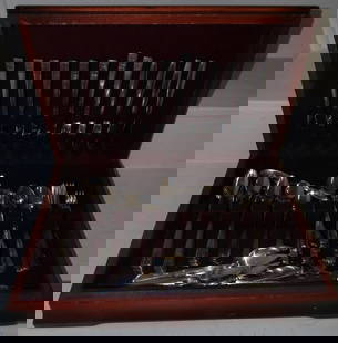 stainless steel flatware in wood box: stainless steel flatware in wood box. 3 1/2" W 17 1/2" W 11 3/4" D ALL DESCRIPTIONS AND ANY CONDITION STATEMENT GIVEN BY LANGSTON AUCTION GALLERY ARE STRICTLY OPINIONS AND LANGSTON'S SHALL HAVE NO RES