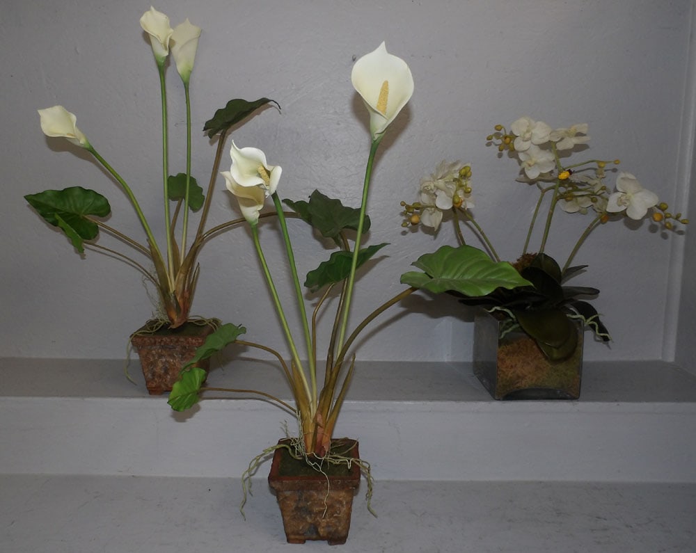 3 faux plants : 3 faux plants . Up to 28" H 5" Dia. ALL DESCRIPTIONS AND ANY CONDITION STATEMENT GIVEN BY LANGSTON AUCTION GALLERY ARE STRICTLY OPINIONS AND LANGSTON'S SHALL HAVE NO RESPONSIBILITY FOR ERRORS OR OMISS