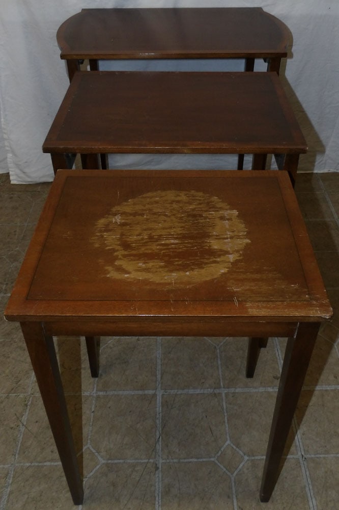 mahogany and satin wood banded top nesting tables : mahogany and satin wood banded top nesting tables . 25" H 25" W 15" D ALL DESCRIPTIONS AND ANY CONDITION STATEMENT GIVEN BY LANGSTON AUCTION GALLERY ARE STRICTLY OPINIONS AND LANGSTON'S SHALL HAVE NO