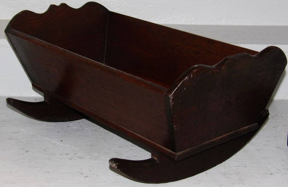 19th Century Child's Walnut Doll Cradle: 19th Century Child's Walnut Doll Cradle. 10" H 22 1/4" W 15 3/4" D ALL DESCRIPTIONS AND ANY CONDITION STATEMENT GIVEN BY LANGSTON AUCTION GALLERY ARE STRICTLY OPINIONS AND LANGSTON'S SHALL HAVE NO RES