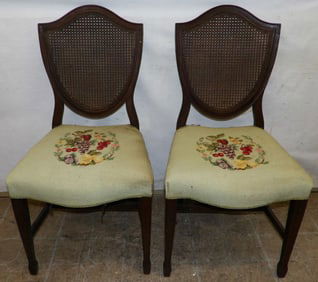 pair of mahogany cane back and needlepoint seat side chairs