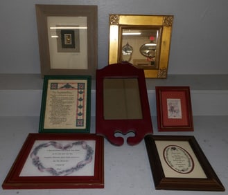 lot of framed art and framed mirrors