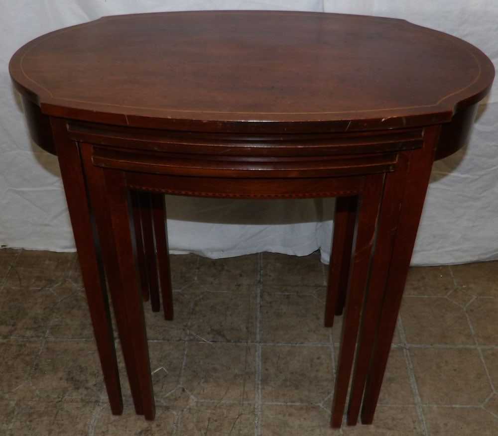 mahogany inlaid nesting tables : mahogany inlaid nesting tables . 27" H 16 1/2" W 25" D ALL DESCRIPTIONS AND ANY CONDITION STATEMENT GIVEN BY LANGSTON AUCTION GALLERY ARE STRICTLY OPINIONS AND LANGSTON'S SHALL HAVE NO RESPONSIBILITY