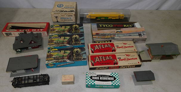 Lot of Vintage Train Cars, Engine, & Tracks: Lot of Vintage Train Cars, Engine, & Tracks. Up to 3" H 13" W 3" D ALL DESCRIPTIONS AND ANY CONDITION STATEMENT GIVEN BY LANGSTON AUCTION GALLERY ARE STRICTLY OPINIONS AND LANGSTON'S SHALL HAVE NO RES