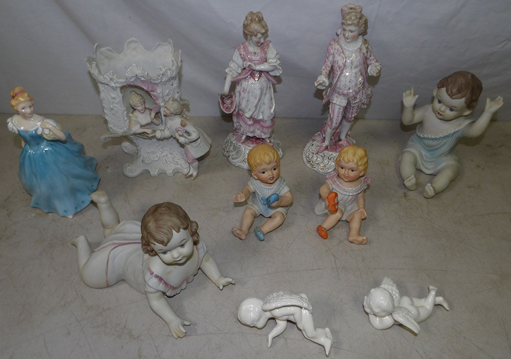 Lot of Porcelain Figurines, Jardiniere, & Piano Babies: Lot of Porcelain Figurines, Jardiniere, & Piano Babies. Up to 10" H 3 1/2" W 3" D ALL DESCRIPTIONS AND ANY CONDITION STATEMENT GIVEN BY LANGSTON AUCTION GALLERY ARE STRICTLY OPINIONS AND LANGSTON'S SH