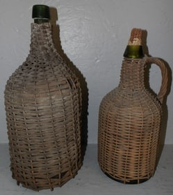 Two Antique Glass Wicker Wrapped Jugs
