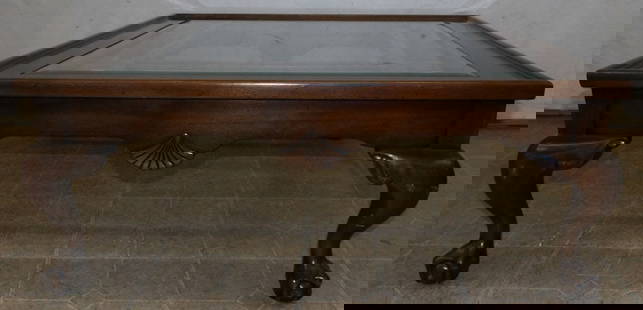 Cherry & Glass Top Cocktail Table with Ball & Claw Feet: Cherry & Glass Top Cocktail Table with Ball & Claw Feet. 16 1/4" H 40" Dia. ALL DESCRIPTIONS AND ANY CONDITION STATEMENT GIVEN BY LANGSTON AUCTION GALLERY ARE STRICTLY OPINIONS AND LANGSTON'S SHALL HA
