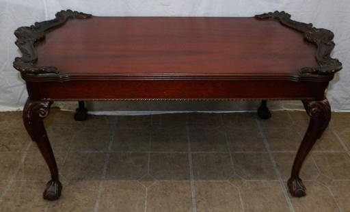 Carved Mahogany Tea Table with Ball & Claw Feet: Carved Mahogany Tea Table with Ball & Claw Feet. 18 1/2" H 39" W 20 1/2" D ALL DESCRIPTIONS AND ANY CONDITION STATEMENT GIVEN BY LANGSTON AUCTION GALLERY ARE STRICTLY OPINIONS AND LANGSTON'S SHALL HAV