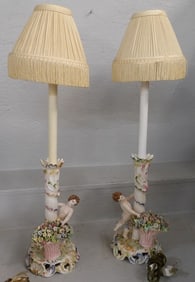 Pair of Painted Porcelain Cherub Lamps, (One Restored)