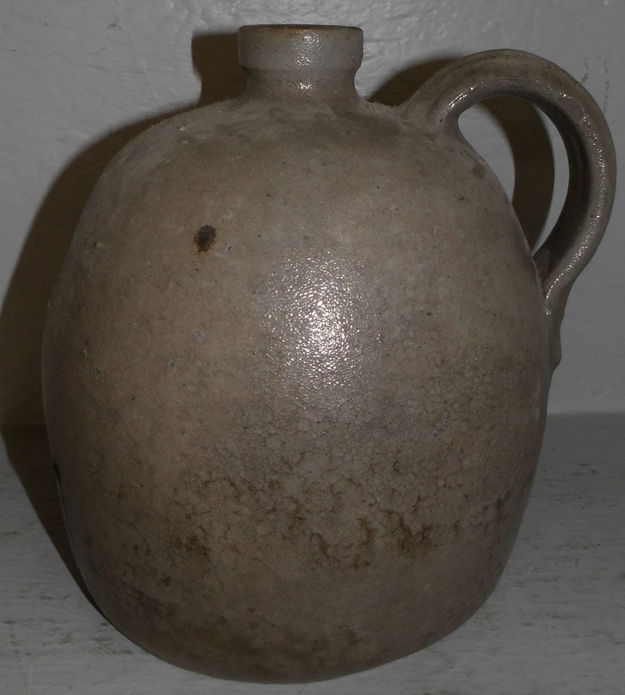Antique Stoneware Whisky Jug: Antique Stoneware Whisky Jug. 9 1/4" H 7" Dia. ALL DESCRIPTIONS AND ANY CONDITION STATEMENT GIVEN BY LANGSTON AUCTION GALLERY ARE STRICTLY OPINIONS AND LANGSTON'S SHALL HAVE NO RESPONSIBILITY FOR ERRO