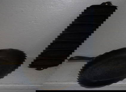 Two Cast Iron Skillets: Two Cast Iron Skillets . 15" L ALL DESCRIPTIONS AND ANY CONDITION STATEMENT GIVEN BY LANGSTON AUCTION GALLERY ARE STRICTLY OPINIONS AND LANGSTON'S SHALL HAVE NO RESPONSIBILITY FOR ERRORS OR OMISSIONS.