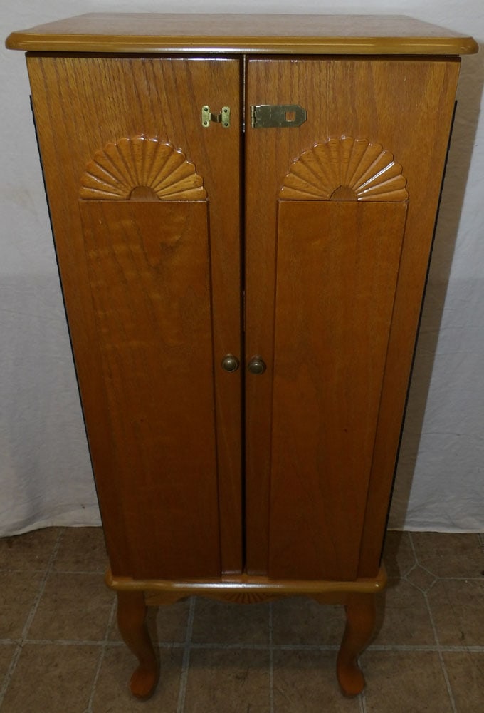 Oak Jewelry Cabinet: Oak Jewelry Cabinet . 38 1/2" H 16 1/4" W 12 1/2" D ALL DESCRIPTIONS AND ANY CONDITION STATEMENT GIVEN BY LANGSTON AUCTION GALLERY ARE STRICTLY OPINIONS AND LANGSTON'S SHALL HAVE NO RESPONSIBILITY FOR