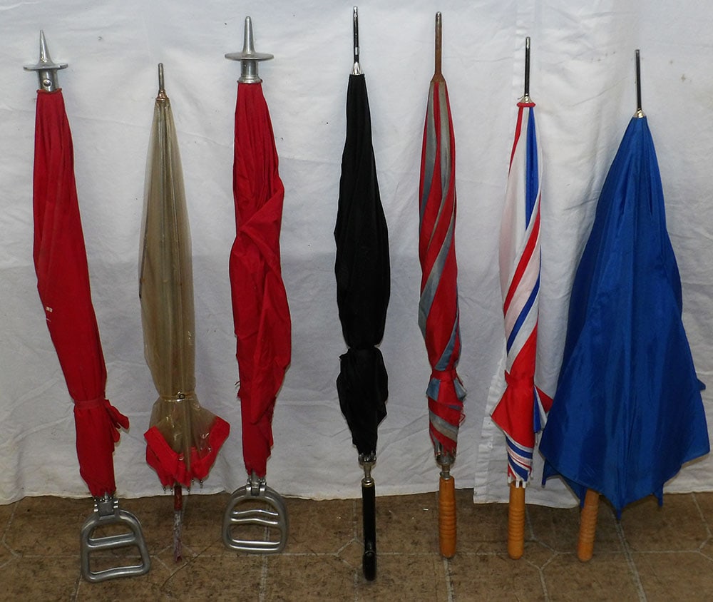 Lot of Umbrellas & Saddle Seat Sticks: Lot of Umbrellas & Saddle Seat Sticks . Up to 35" L ALL DESCRIPTIONS AND ANY CONDITION STATEMENT GIVEN BY LANGSTON AUCTION GALLERY ARE STRICTLY OPINIONS AND LANGSTON'S SHALL HAVE NO RESPONSIBILITY FOR