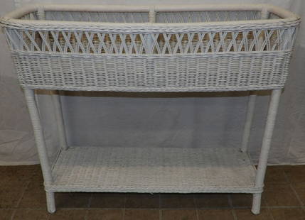 Painted Wicker Planter: Painted Wicker Planter . 30 3/4" H 36" W 13 1/2" D ALL DESCRIPTIONS AND ANY CONDITION STATEMENT GIVEN BY LANGSTON AUCTION GALLERY ARE STRICTLY OPINIONS AND LANGSTON'S SHALL HAVE NO RESPONSIBILITY FOR