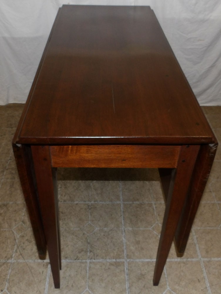 19th Century Cherry Dining Table: 19th Century Cherry Dining Table . 29" H 43" W 18 1/2" D ALL DESCRIPTIONS AND ANY CONDITION STATEMENT GIVEN BY LANGSTON AUCTION GALLERY ARE STRICTLY OPINIONS AND LANGSTON'S SHALL HAVE NO RESPONSIBILIT