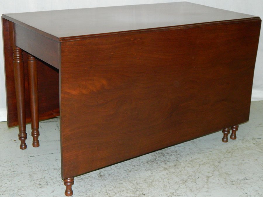 Three board walnut drop leaf dining table.: Beautiful three board walnut drop leaf dining table with six turn legs. 69" open x 47" deep x 28 3/4" tall.
