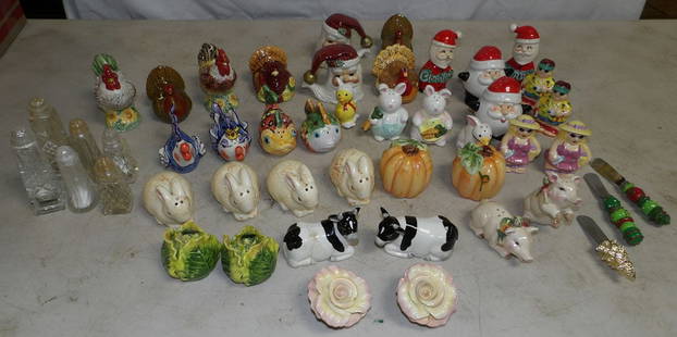 Lot of Porcelain Salt & Pepper Shakers & Butter Spreaders: Lot of Porcelain Salt & Pepper Shakers & Butter Spreaders. Up to 5" H 1 1/2" Dia. ALL DESCRIPTIONS AND ANY CONDITION STATEMENT GIVEN BY LANGSTON AUCTION GALLERY ARE STRICTLY OPINIONS AND LANGSTON'S SH