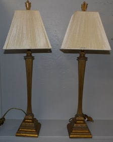 pair of painted resin lamps