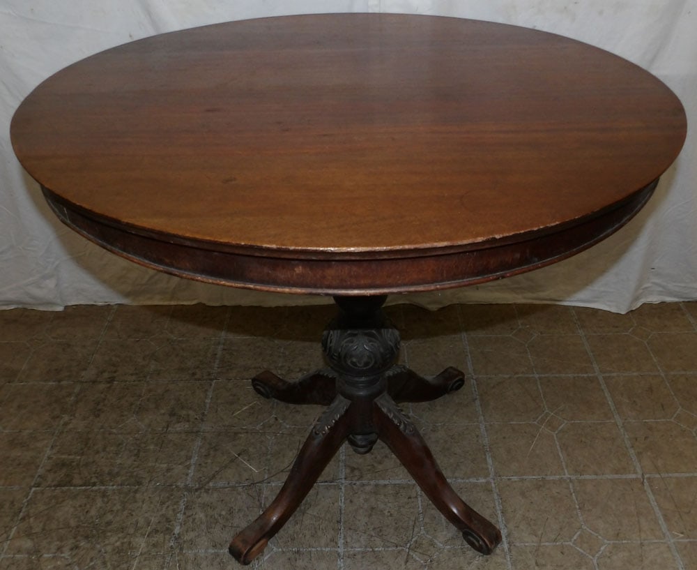 mahogany tilt top tea table: mahogany tilt top tea table . 34" Dia. 29 3/4" H ALL DESCRIPTIONS AND ANY CONDITION STATEMENT GIVEN BY LANGSTON AUCTION GALLERY ARE STRICTLY OPINIONS AND LANGSTON'S SHALL HAVE NO RESPONSIBILITY FOR ER