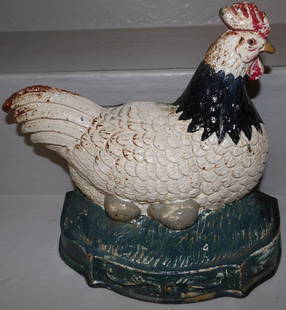painted cast iron hen on the nest door stop: painted cast iron hen on the nest door stop . 8 1/2" H 9" W 3" D ALL DESCRIPTIONS AND ANY CONDITION STATEMENT GIVEN BY LANGSTON AUCTION GALLERY ARE STRICTLY OPINIONS AND LANGSTON'S SHALL HAVE NO RESPO