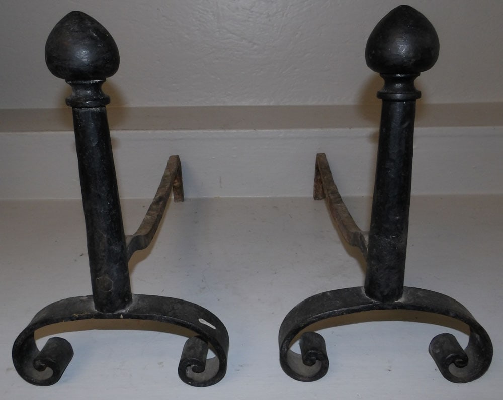 pair of cast iron andirons: pair of cast iron andirons. 15" H 9" W 20 1/4" D ALL DESCRIPTIONS AND ANY CONDITION STATEMENT GIVEN BY LANGSTON AUCTION GALLERY ARE STRICTLY OPINIONS AND LANGSTON'S SHALL HAVE NO RESPONSIBILITY FOR ER