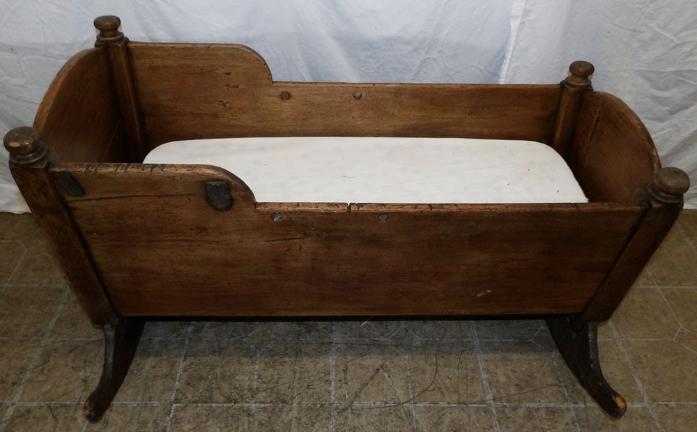 19th century walnut baby cradle: 19th century walnut baby cradle. 22 3/4L 26 1/4 W37 1/2H ALL DESCRIPTIONS AND ANY CONDITION STATEMENT GIVEN BY LANGSTON AUCTION GALLERY ARE STRICTLY OPINIONS AND LANGSTON'S SHALL HAVE NO RESPONSIBILIT
