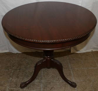 carved mahogany drum table: carved mahogany drum table . 23 3/4" H 24" Dia. ALL DESCRIPTIONS AND ANY CONDITION STATEMENT GIVEN BY LANGSTON AUCTION GALLERY ARE STRICTLY OPINIONS AND LANGSTON'S SHALL HAVE NO RESPONSIBILITY FOR ERR