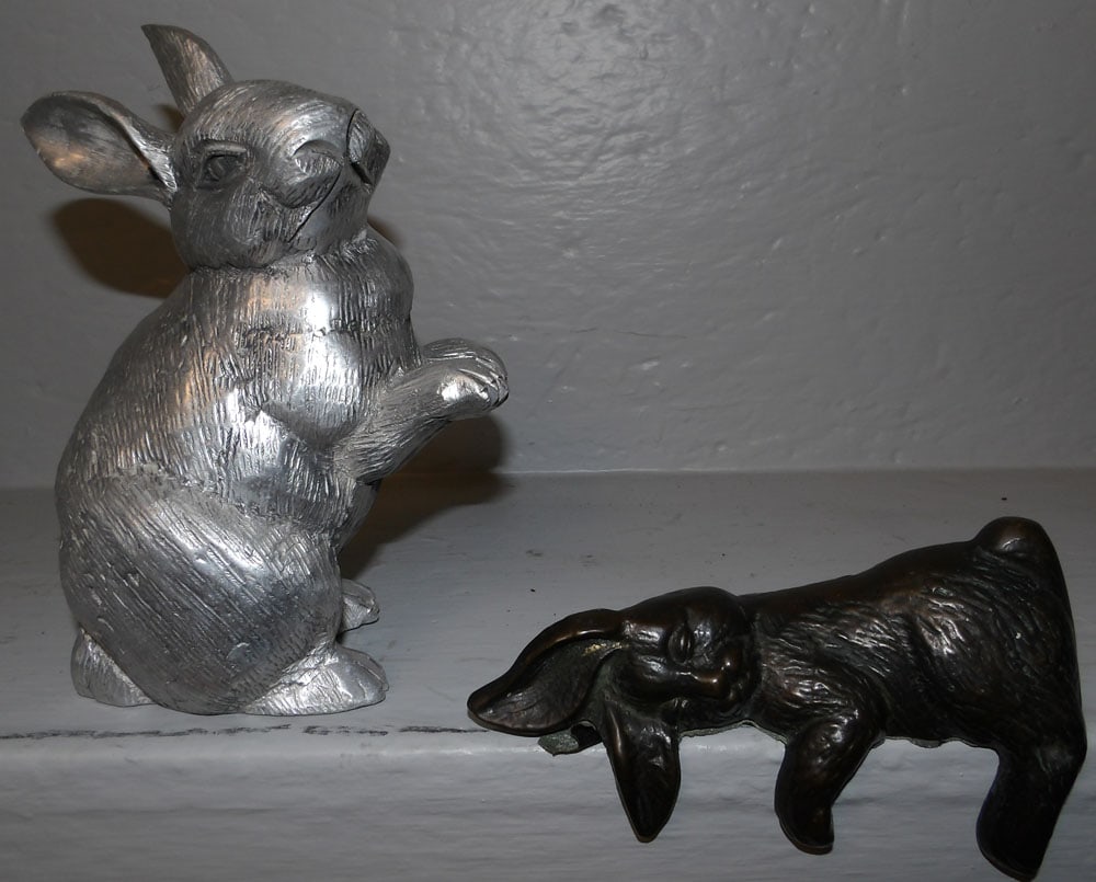 one cast aluminum and one copper finish bunny figurines: one cast aluminum and one copper finish bunny figurines . Up to 7 1/2" H 6" W ALL DESCRIPTIONS AND ANY CONDITION STATEMENT GIVEN BY LANGSTON AUCTION GALLERY ARE STRICTLY OPINIONS AND LANGSTON'S SHALL