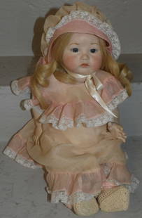 porcelain French doll: porcelain French doll. 16 1/2" L ALL DESCRIPTIONS AND ANY CONDITION STATEMENT GIVEN BY LANGSTON AUCTION GALLERY ARE STRICTLY OPINIONS AND LANGSTON'S SHALL HAVE NO RESPONSIBILITY FOR ERRORS OR OMISSION